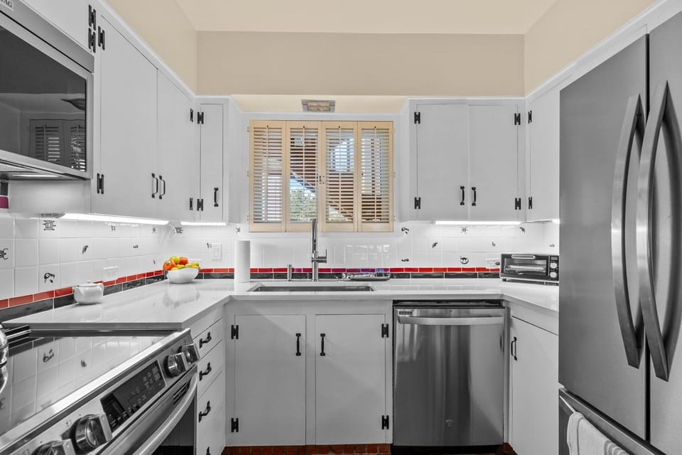 Bright modern kitchen with stainless steel appliances and great prep space