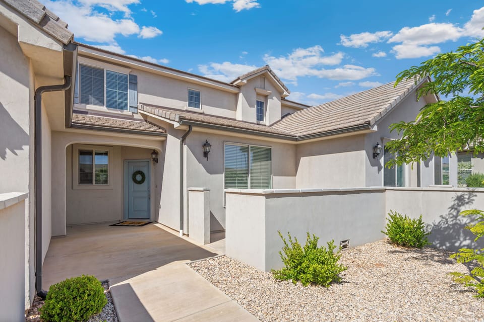 Easy-to-find townhome entrance with garage/driveway access and a convenient location near the community amenities.