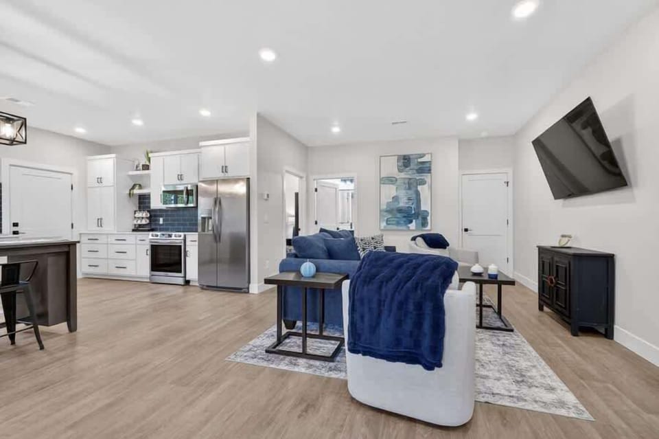 Lower Level unit: Step into your bright open-concept retreat where modern elegance meets cozy comfort.