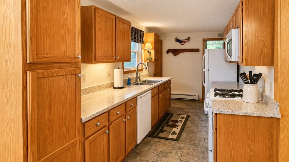The fully equipped kitchen offers plenty of counter space, modern appliances, and everything needed to prepare meals during your stay.