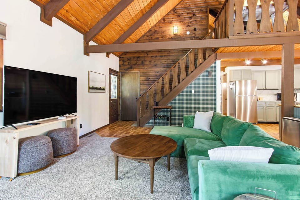 Settle into a bright, open living space where cozy cabin character meets modern comfort for relaxed nights together.