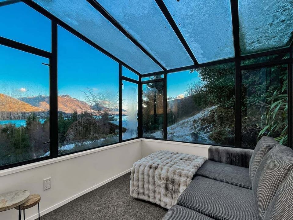 Sunroom with panoramic lake views