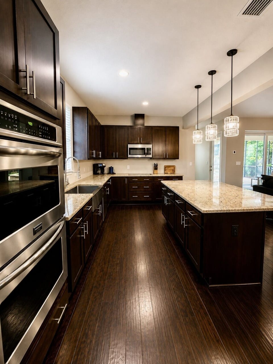 Chef’s Kitchen Designed for gathering, this spacious gourmet kitchen features an oversized island, double ovens, stainless steel appliances, granite countertops, and all the essentials to cook everything from breakfast to family dinners.