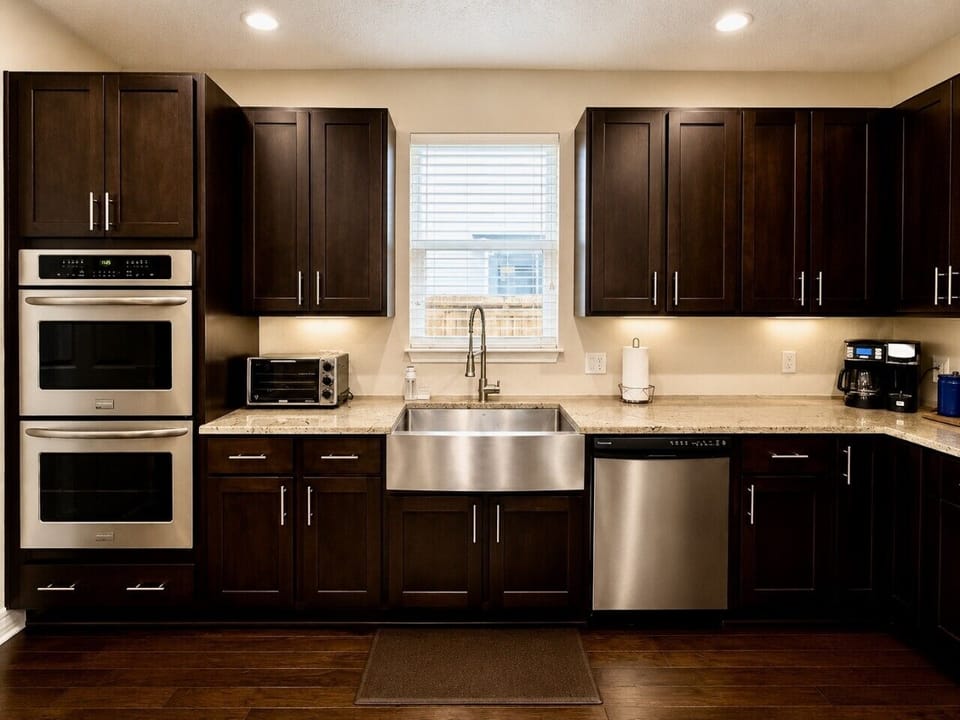 Modern cooking space with ample counter space, quality cookware, knife set, coffee station, and all the essentials for home chefs