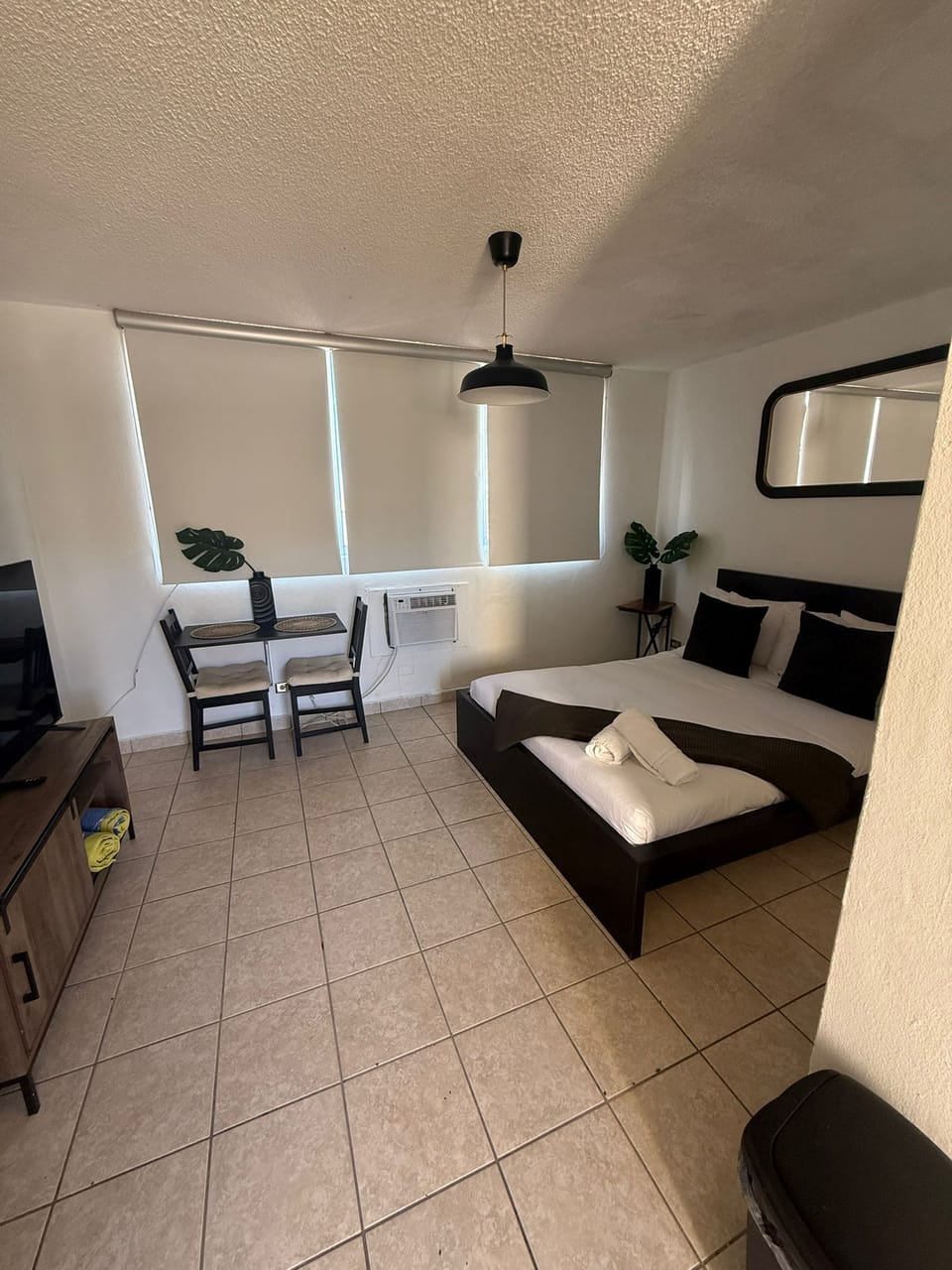 room, indoor, climate control, bed, private space, television, daytime