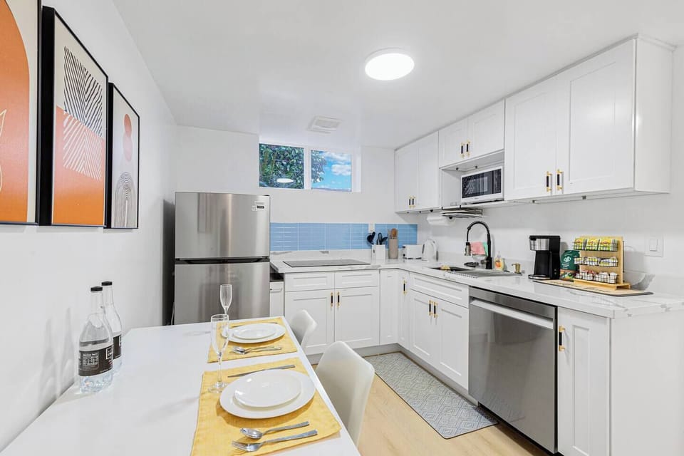 A view of the fully equipped kitchen is shown here, highlighting its modern appliances and spacious design. 
