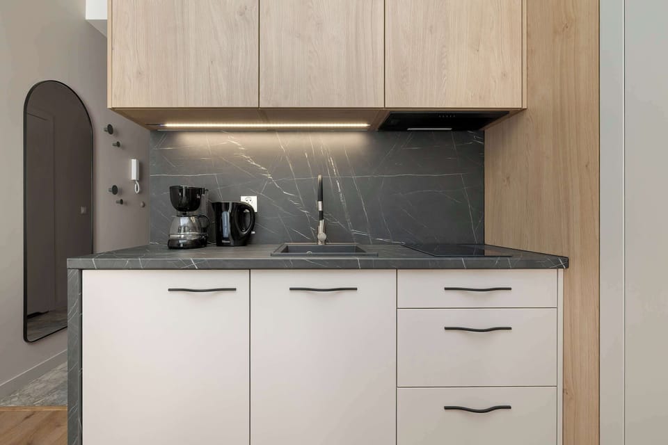 The kitchenette is designed to be practical and use space efficiently.