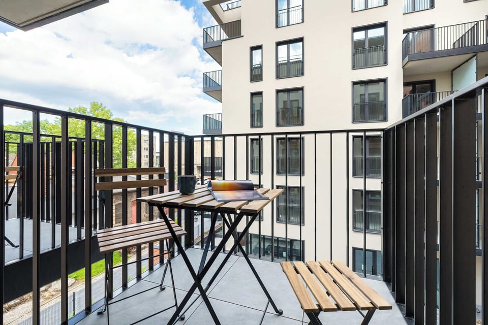 The balcony provides a perfect spot for enjoying the fresh air. 
