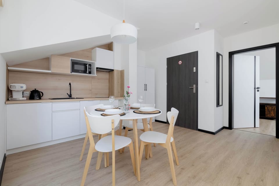 Cook and dine in style with the modern kitchenette and dining area.