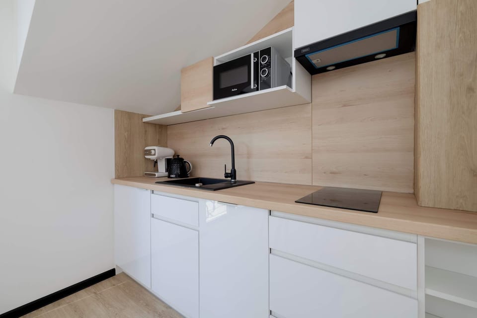 The kitchenette's practical layout maximizes space and functionality.