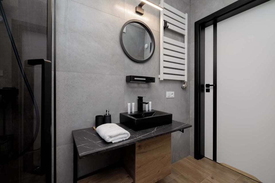 The bathroom offers a clean and functional space for your stay. 