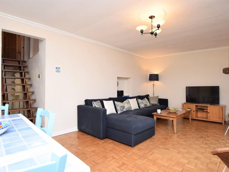 Lounge area with view to stairs leading to bedrooms