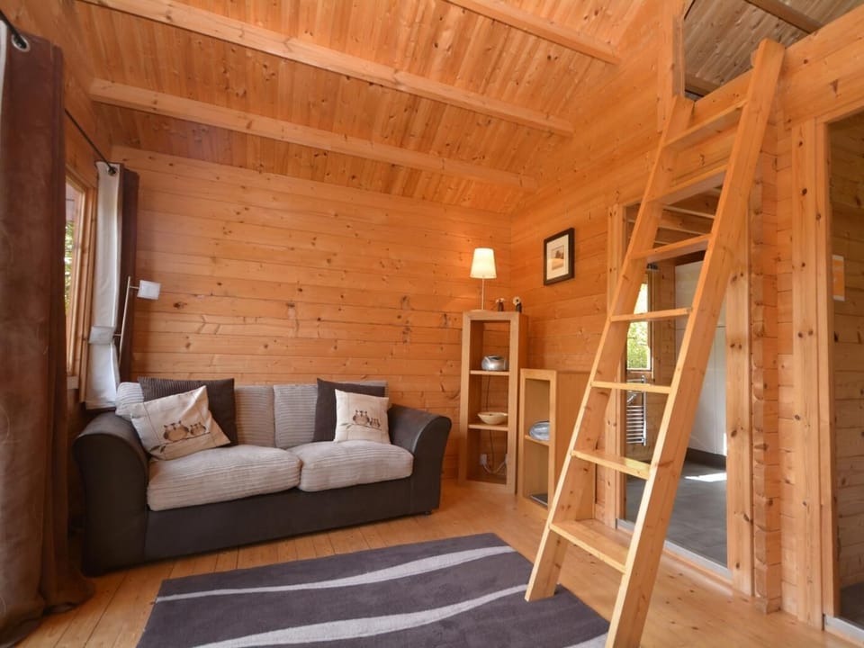 Lounge area with ladder to sleeping area