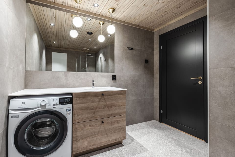 Modern and new bathroom with washing machine