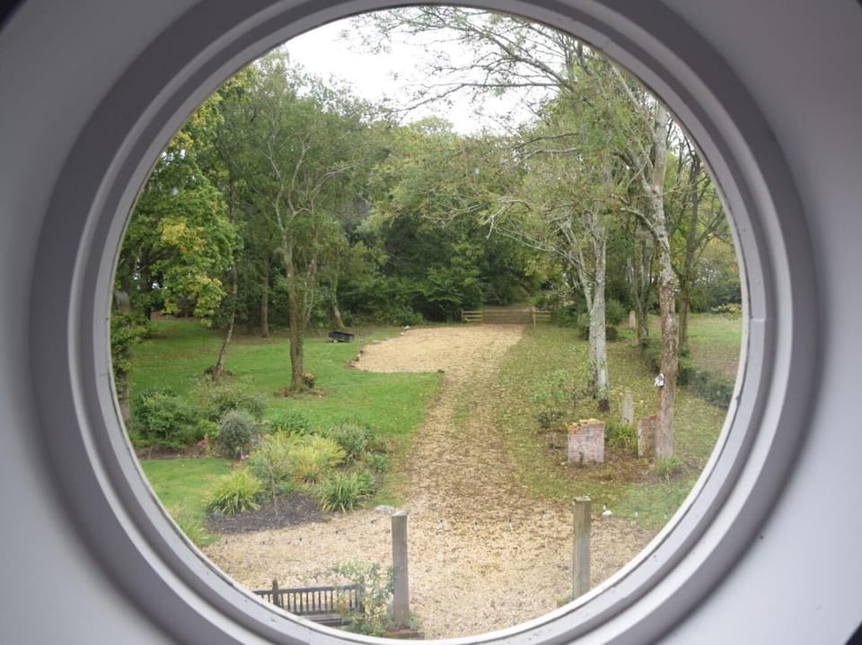 Glimpse the river from the quirky circular window