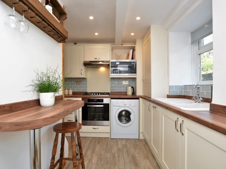 Prepare a meal in the well-equipped kitchen