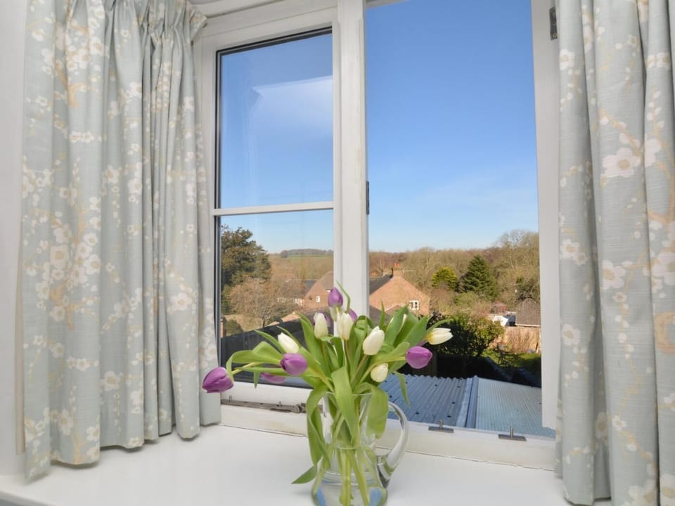 Wake up to views over the village and countryside beyond