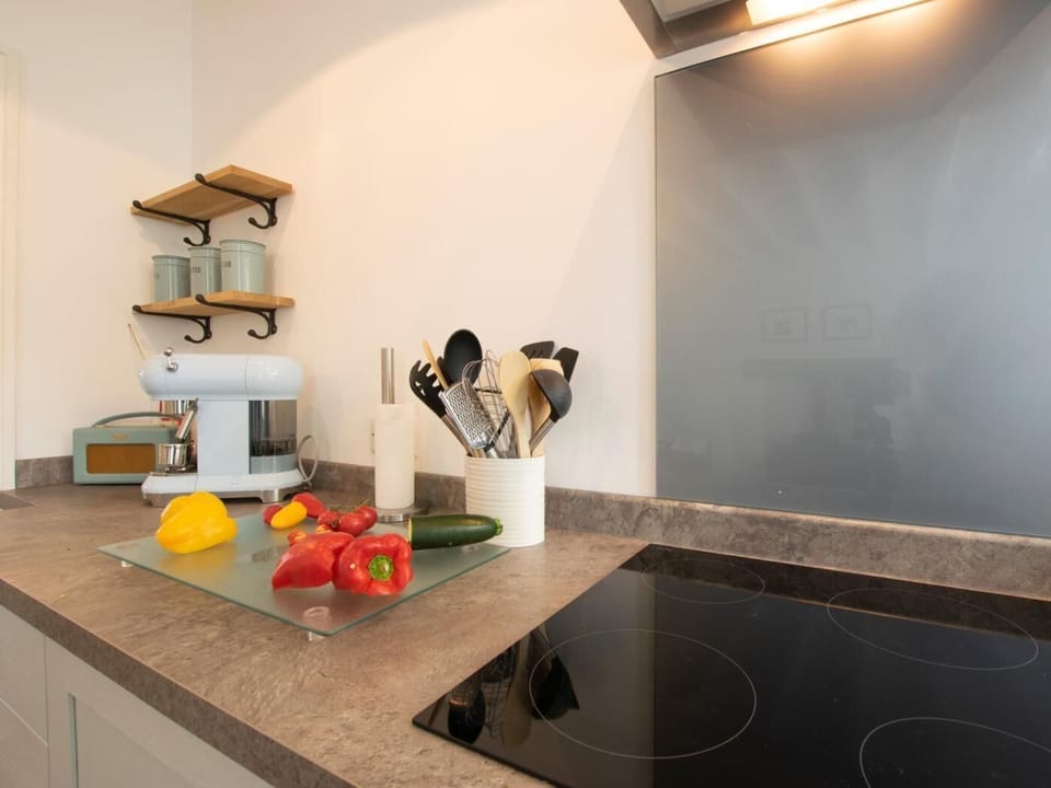 Kitchen with induction hob and coffee machine