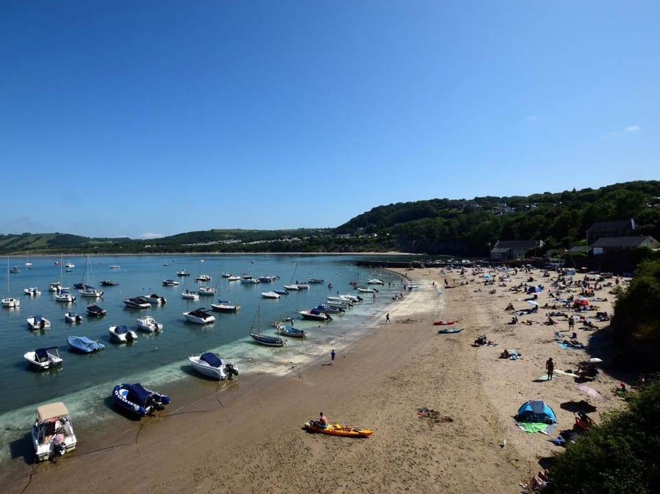 Enjoy a day on the bustling beach at New Quay, just meters from your doorstep