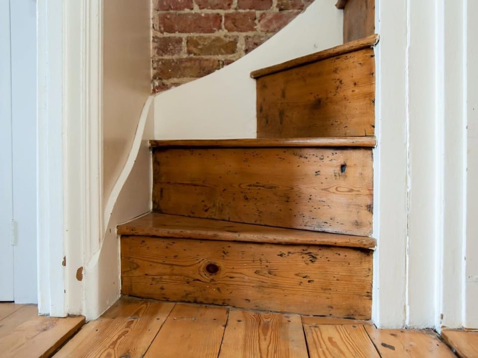 Steep, winding stairs take you to the twin bedroom