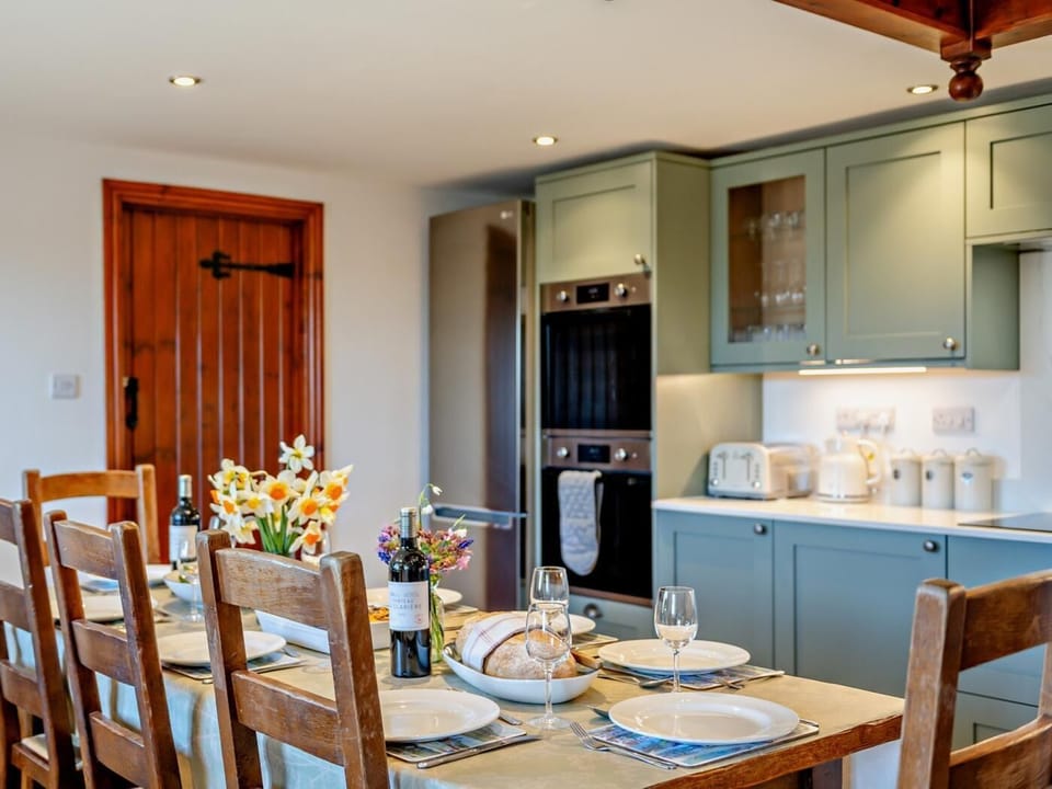 This large space has a family dining table at the centre