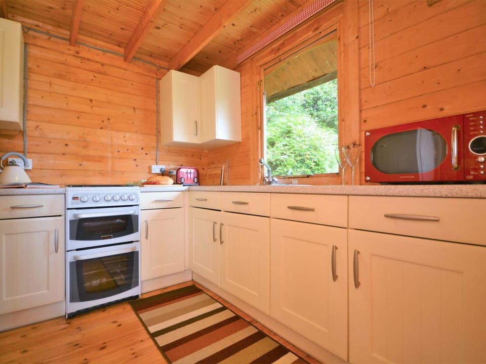 Kitchen accessed via living area