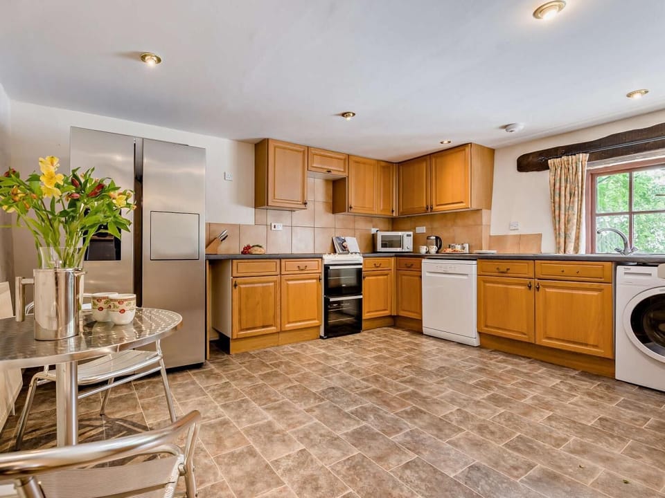 The large kitchen has everything you need for your stay