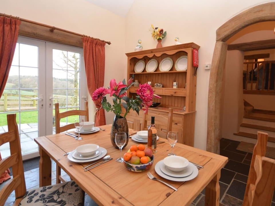 Kitchen/diner with doors leading to the garden