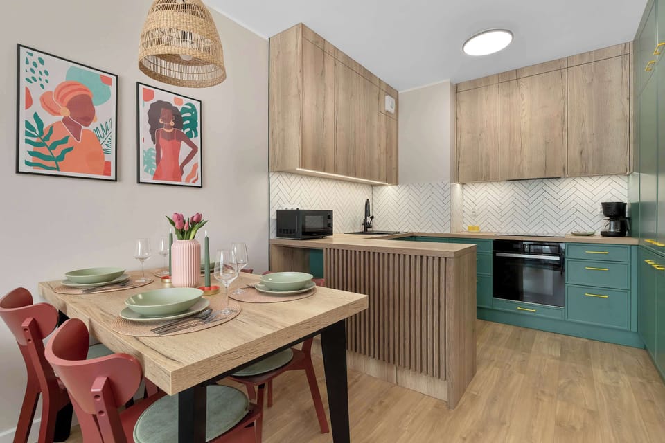 A modern dining area next to the fully equipped kitchen. It's a great spot to enjoy homemade meals together.