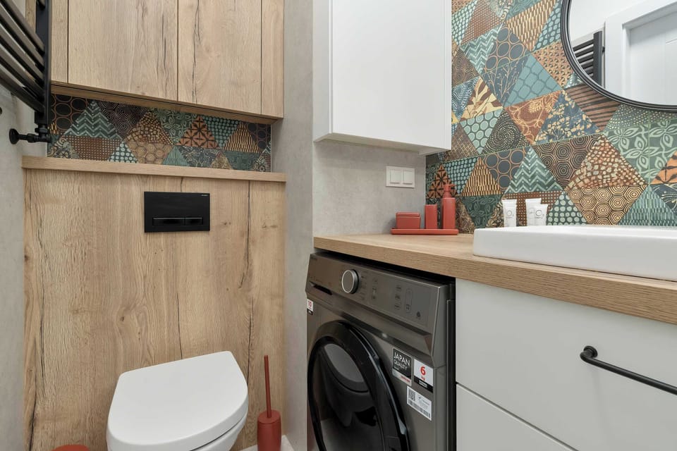 A modern bathroom with a spacious walk-in shower and elegant finishes. Everything is designed to provide comfort and convenience during your stay.
