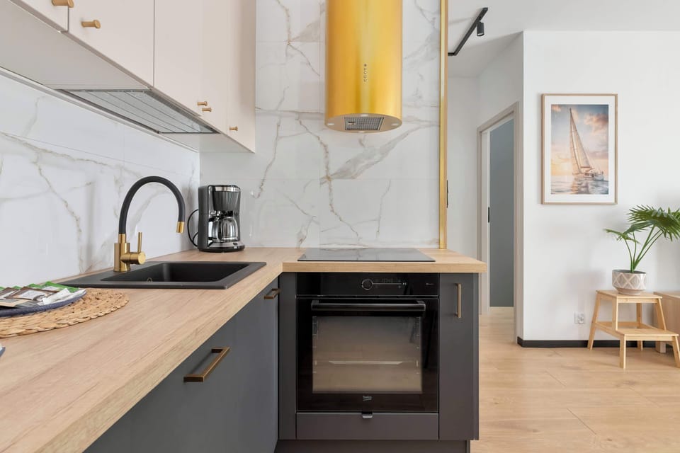 A fully equipped kitchenette with modern appliances. Prepare delicious meals and enjoy the convenience of home cooking.