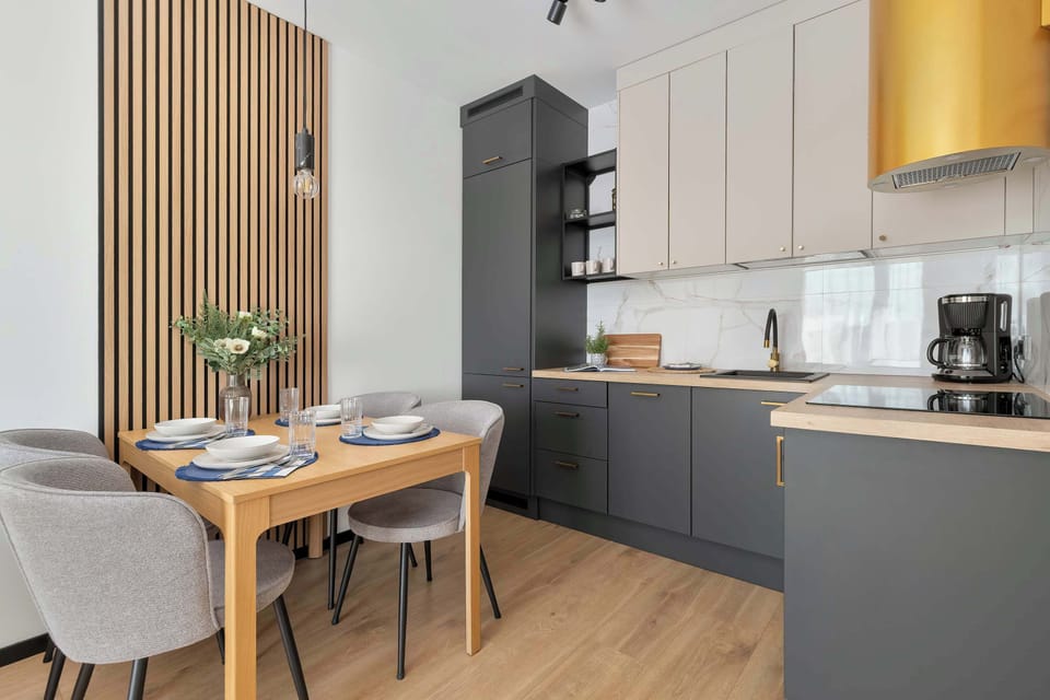 A modern dining area next to the fully equipped kitchen. It's a great place to enjoy meals together.