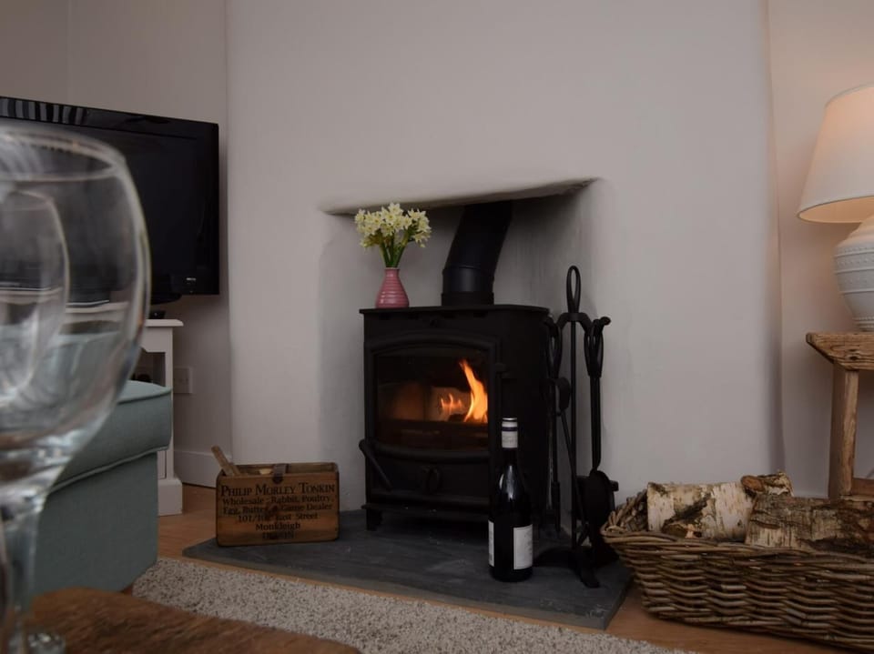 Settle down with a glass of wine in front of the woodburner