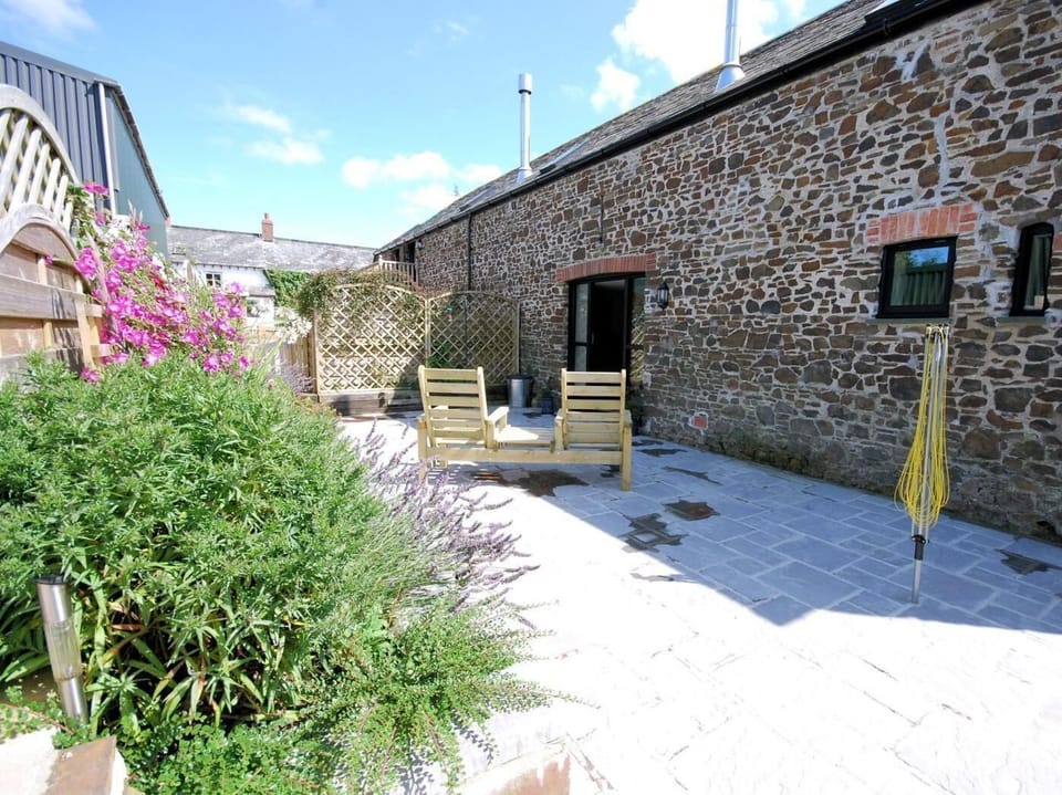 Outside enclosed space to the rear of the barn