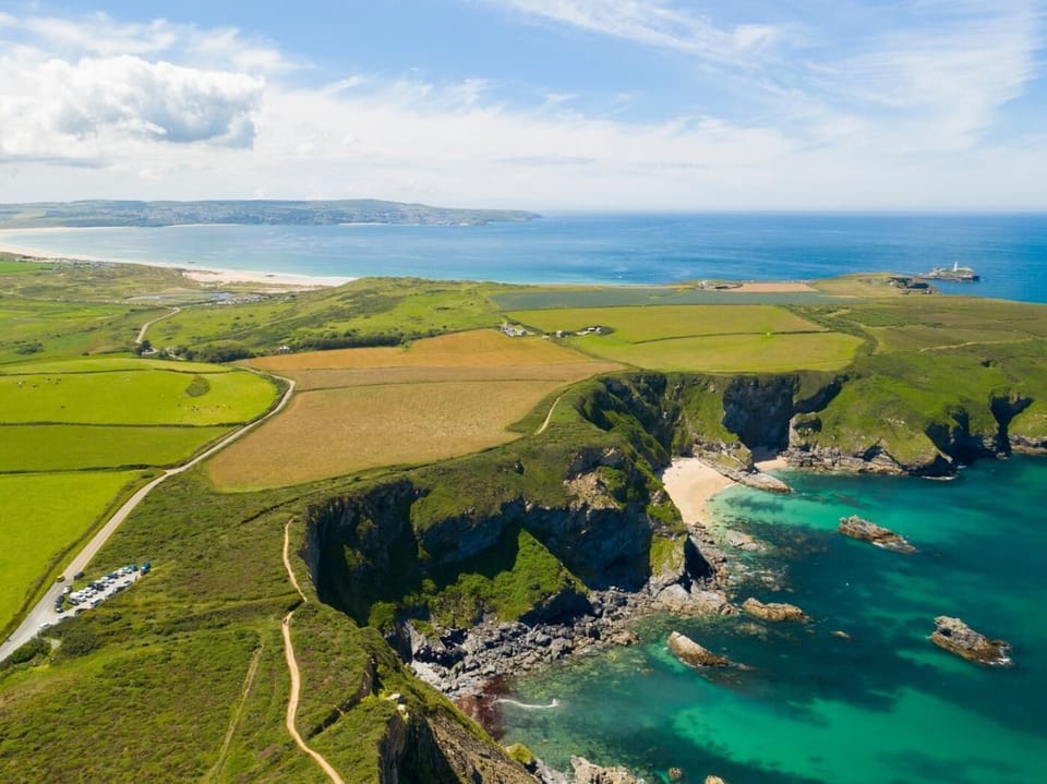 Enjoy the scenic drive from Portreath to Gwithian along Hell's Mouth cliffs