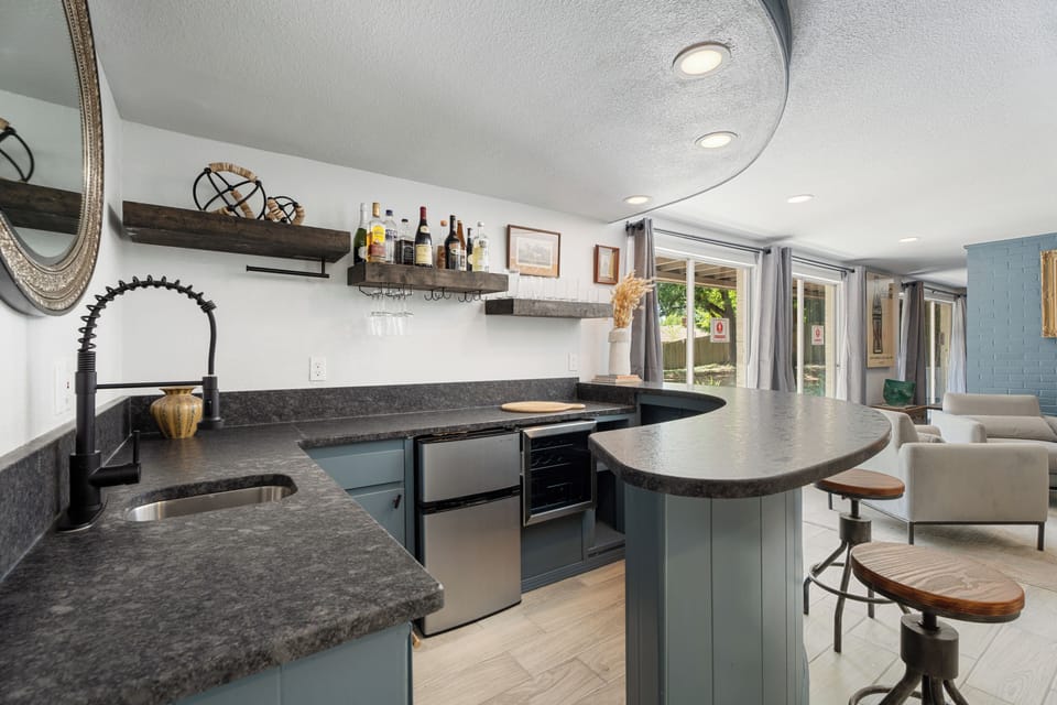 Whip up your favorite meals in this modern kitchen with a stylish bar seating area – perfect for casual dining and socializing.