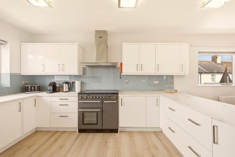 Modern fully equipped kitchen with generous workspace for effortless self-catering