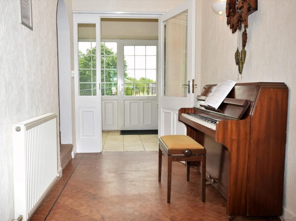 Entrance hallway with piano