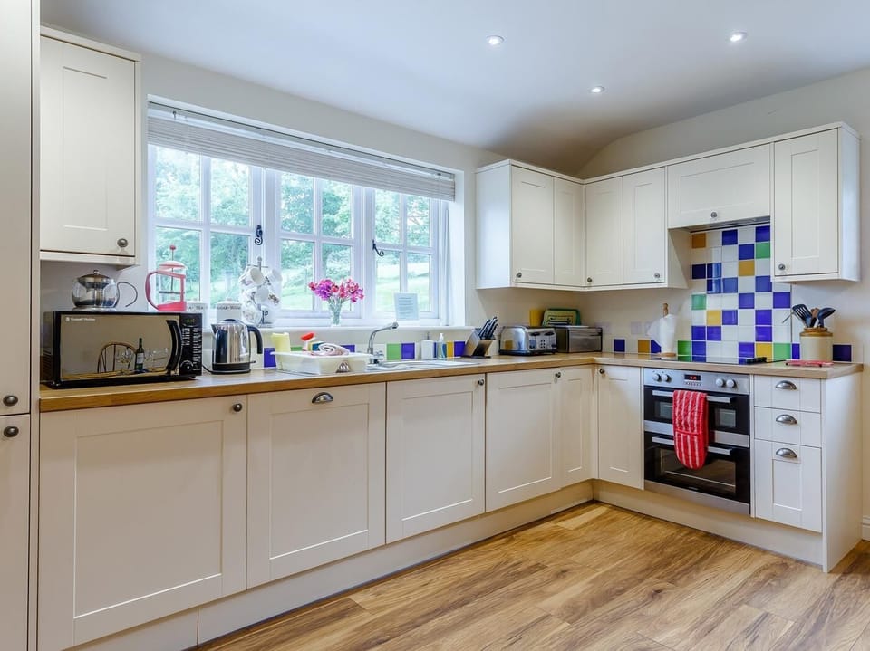 Well equipped throughout, with views of the ground from the kitchen