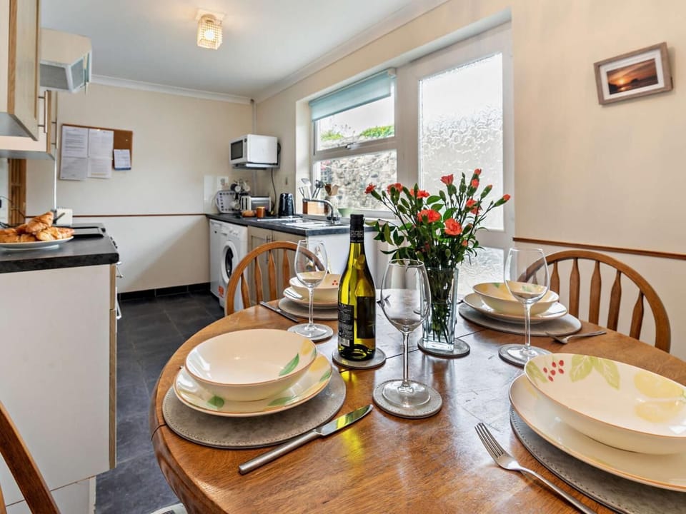 The kitchen leads straight out onto a rear seating area