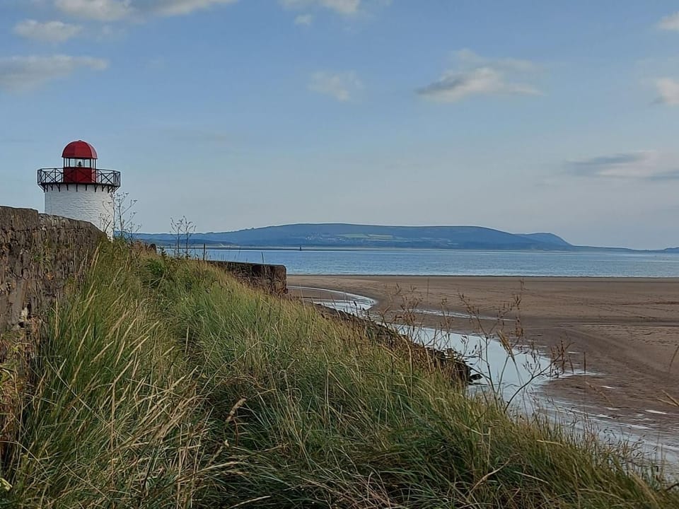 Visit Burry Port with its sandy beach and lighthouse