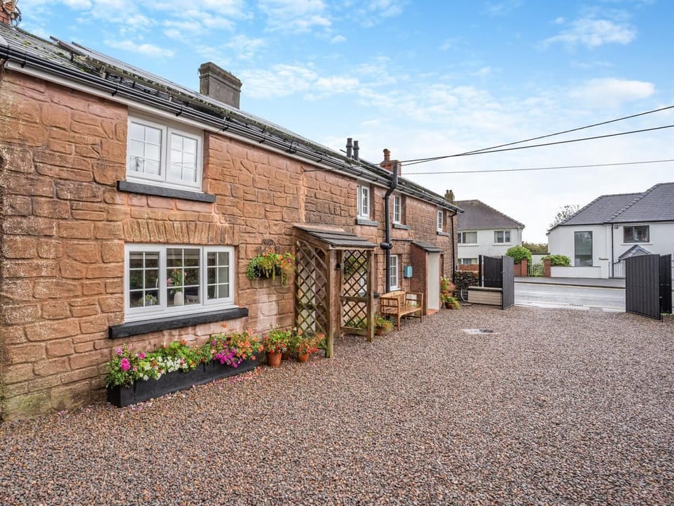Enclosed shared area with the holiday cottage next door via large entrance gates