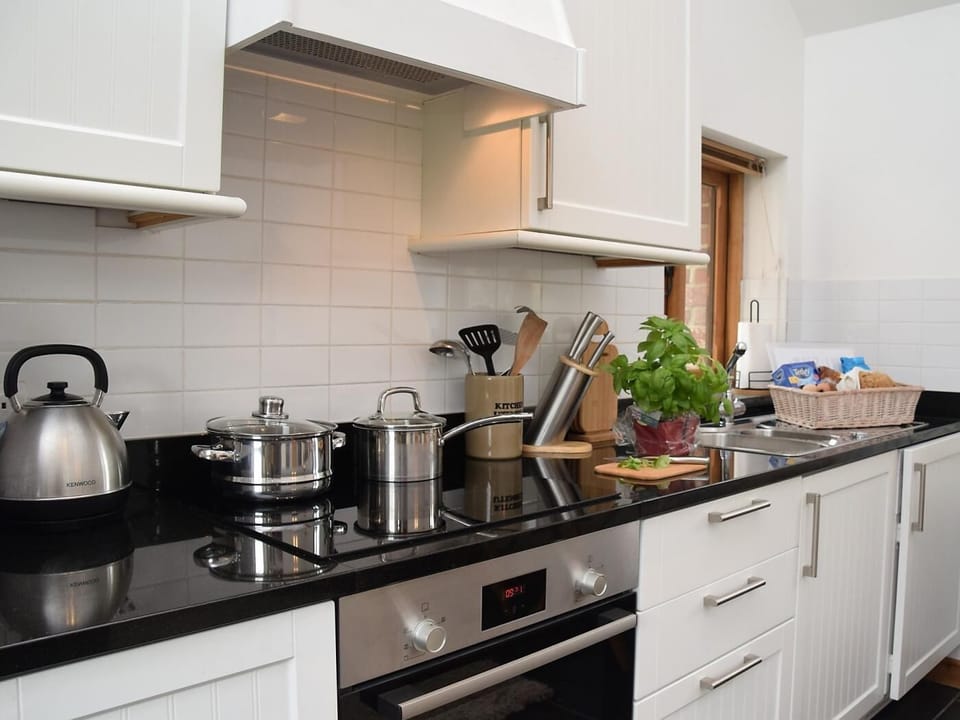 Cook up a storm in this well equipped kitchen with new granite worktops and Induction hob