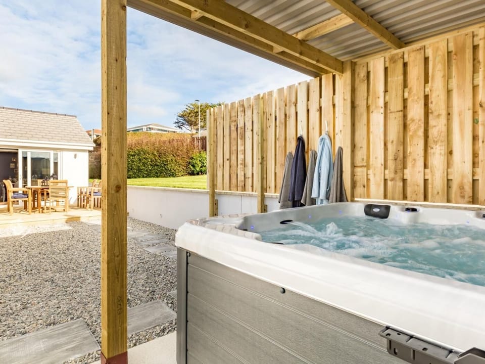 Take a dip in the covered hot tub