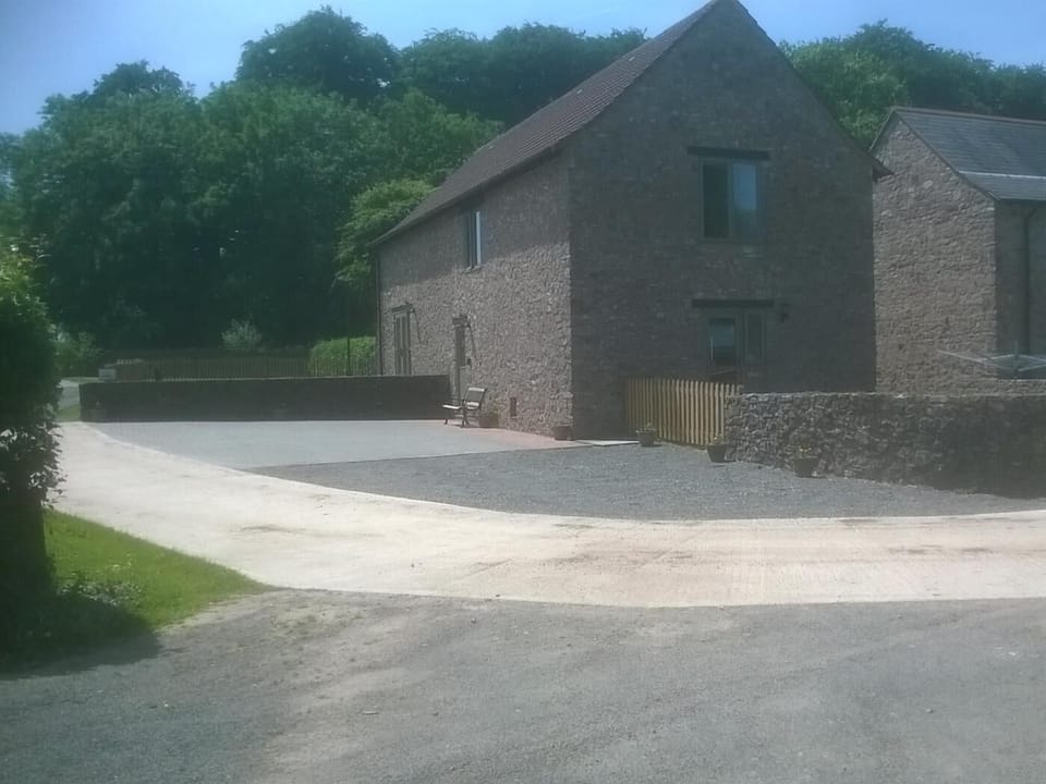 View to the front of the property with parking area