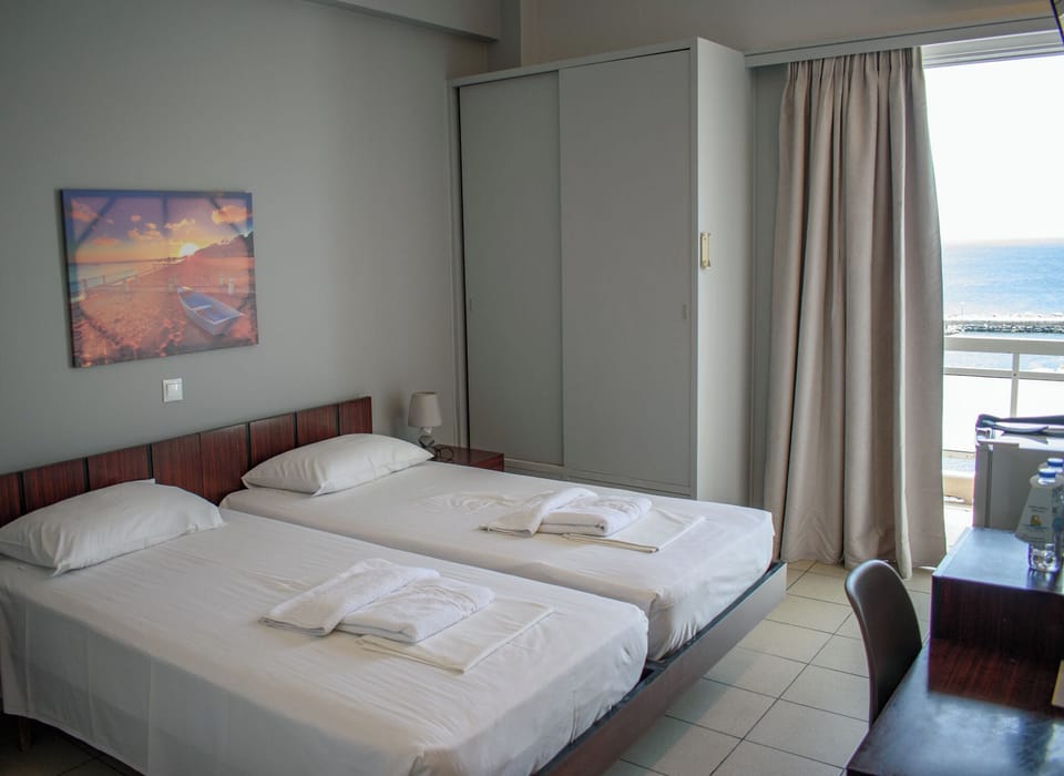 Twin Room, Balcony, City View | Laptop workspace, WiFi (free), bed sheets