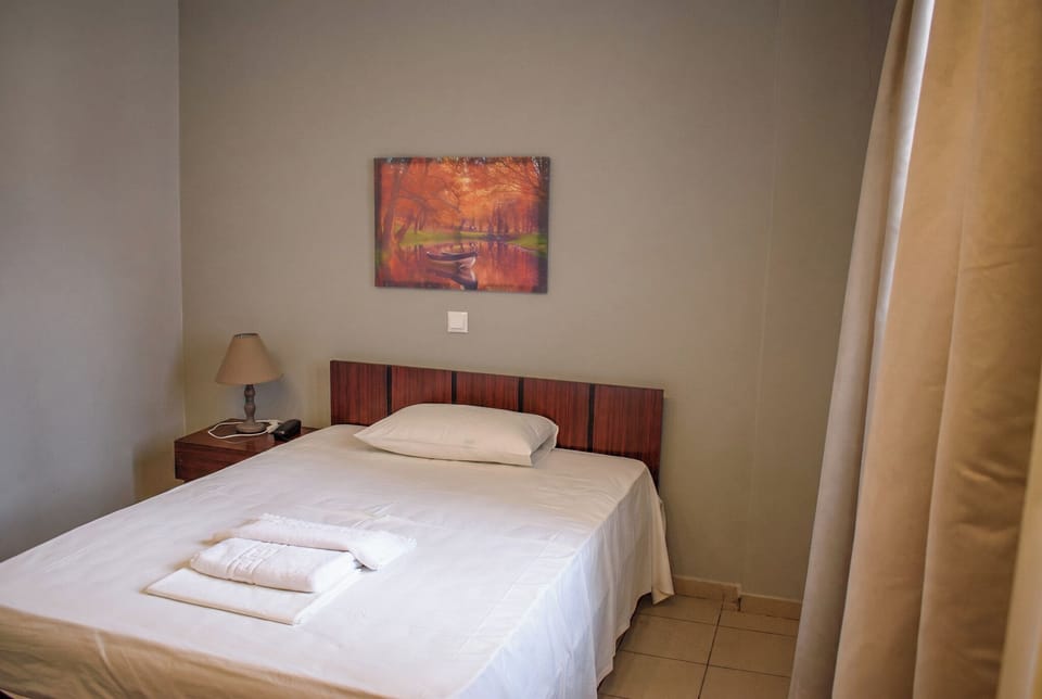 Standard Single Room, City View | Laptop workspace, WiFi (free), bed sheets