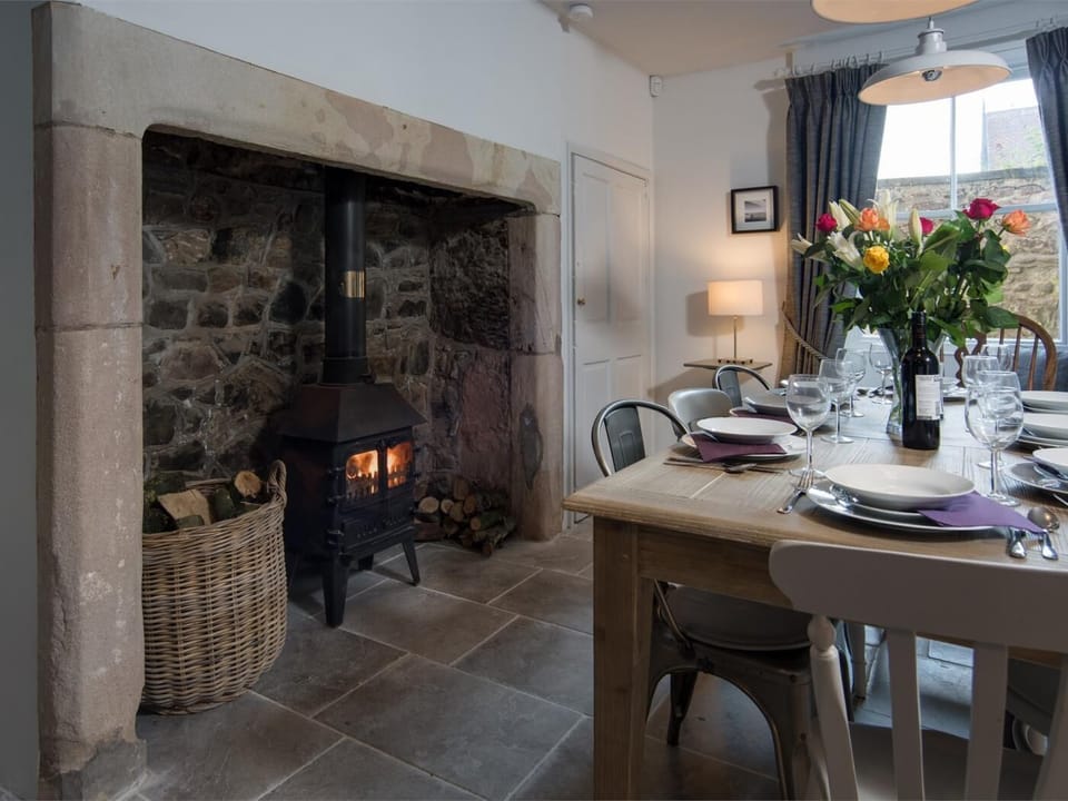 Original fireplace adds to the charm of the dining room