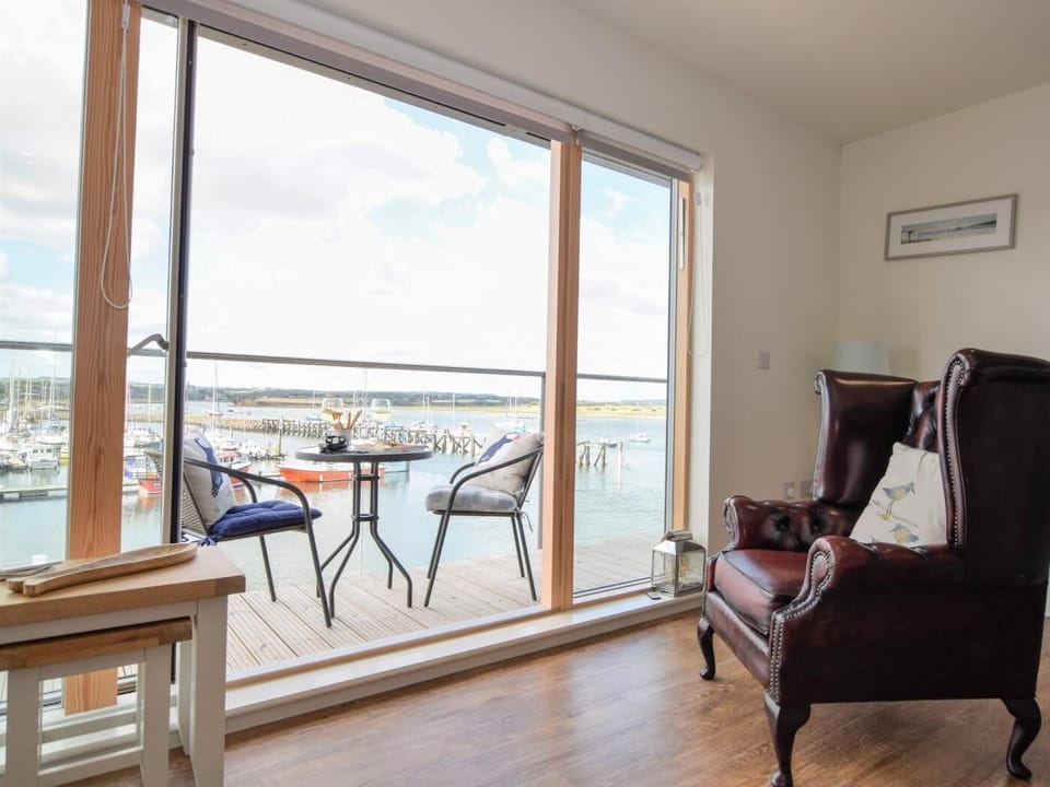 Open the doors and let the light flood in while you relax, listening to harbour life