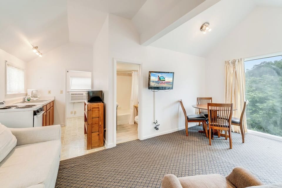 Flat Screen Cable TV and comfy furnishings to sink into after a day of fun in the sun!